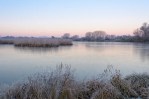 Frozen lake in winter, Reinheimer Teich, Reinheim, Hesse, Germany Frozen lake in winter, Reinheimer Teich, Reinheim, Hesse, Germany